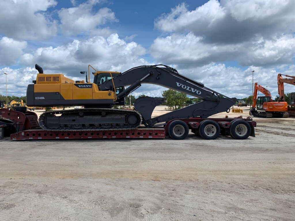 Volvo excavator loaded on a lowboy trailer